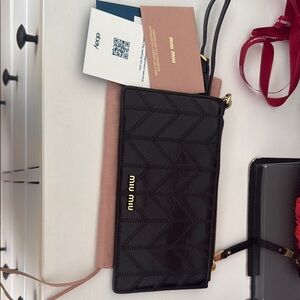 Miu Miu Black Clutch with Gold Accents